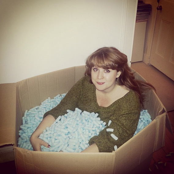 Mandy Fleetwood in box of protective packaging materials